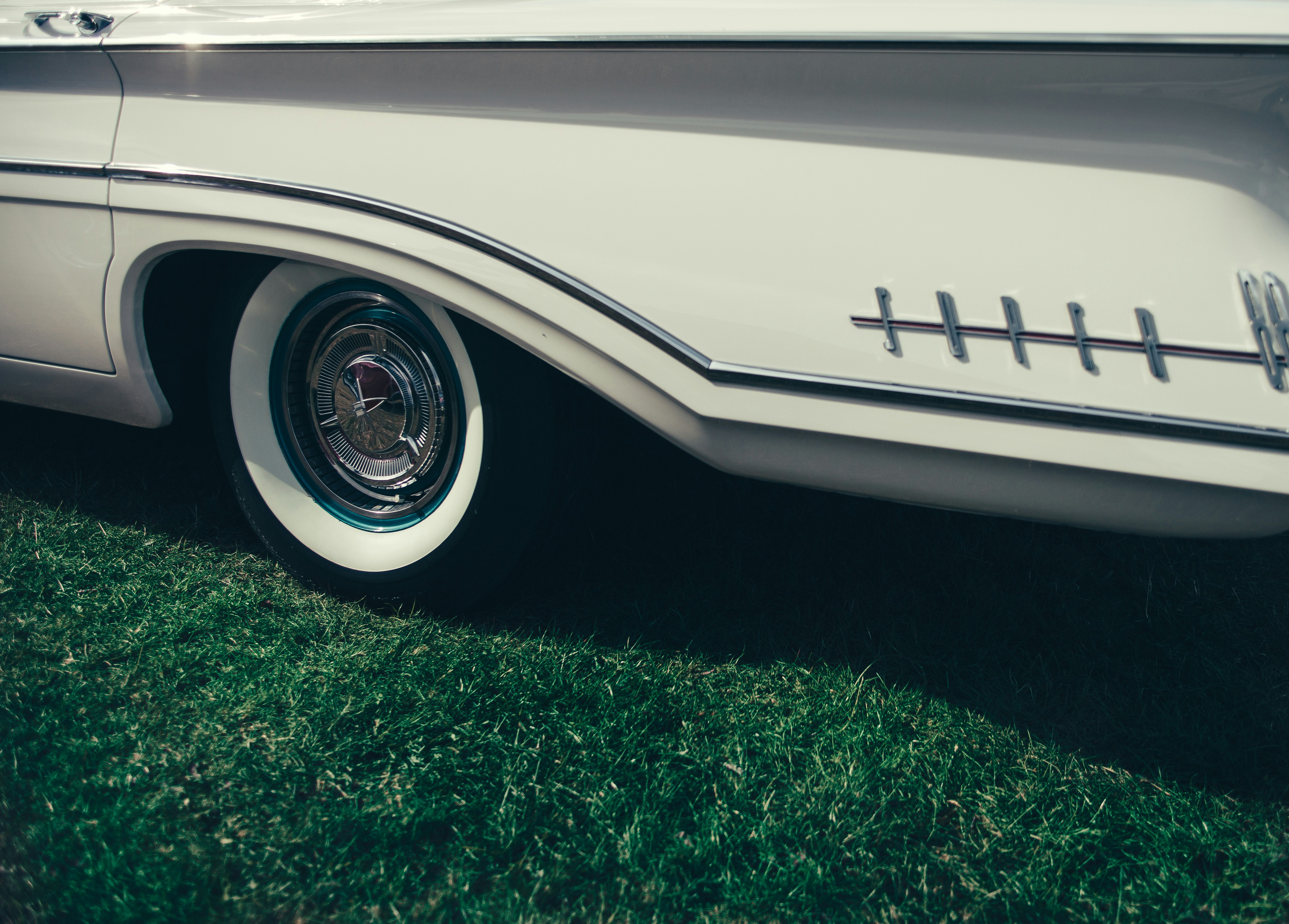 close-up photo of chrome wheel with tire